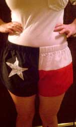 model wearing Texas flag shorts